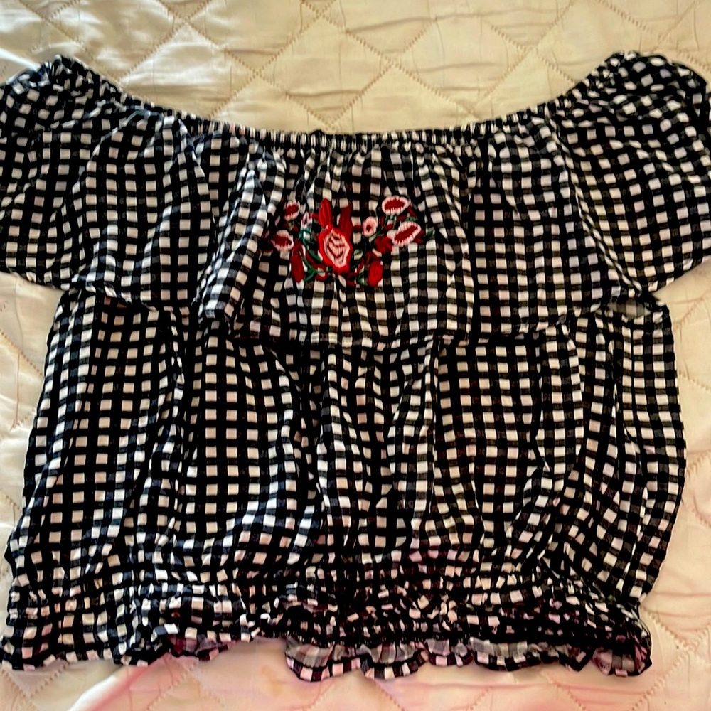 Black and white checked off shoulder top. Embroidered flowers on front frill
